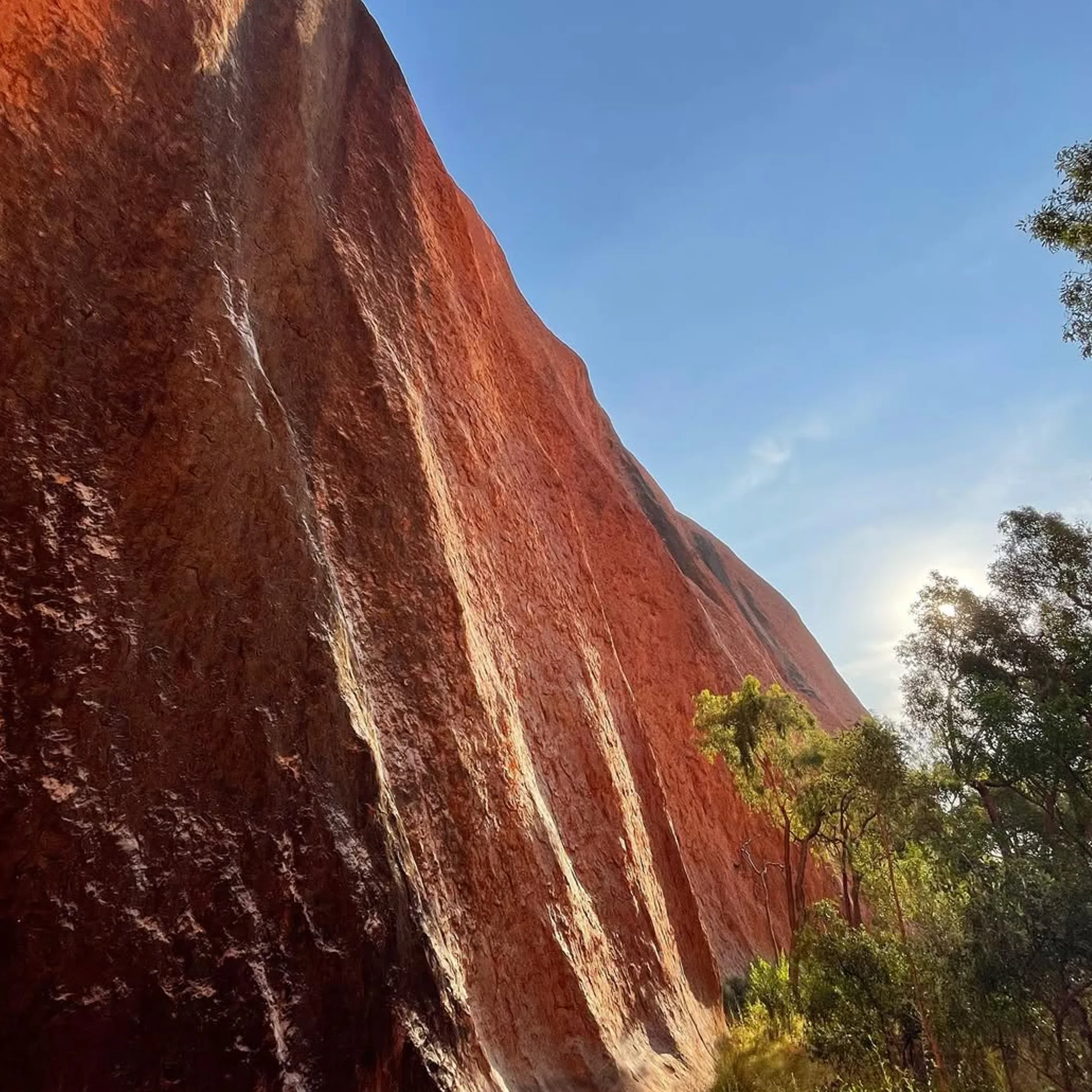 uluru rock under clear blue sky