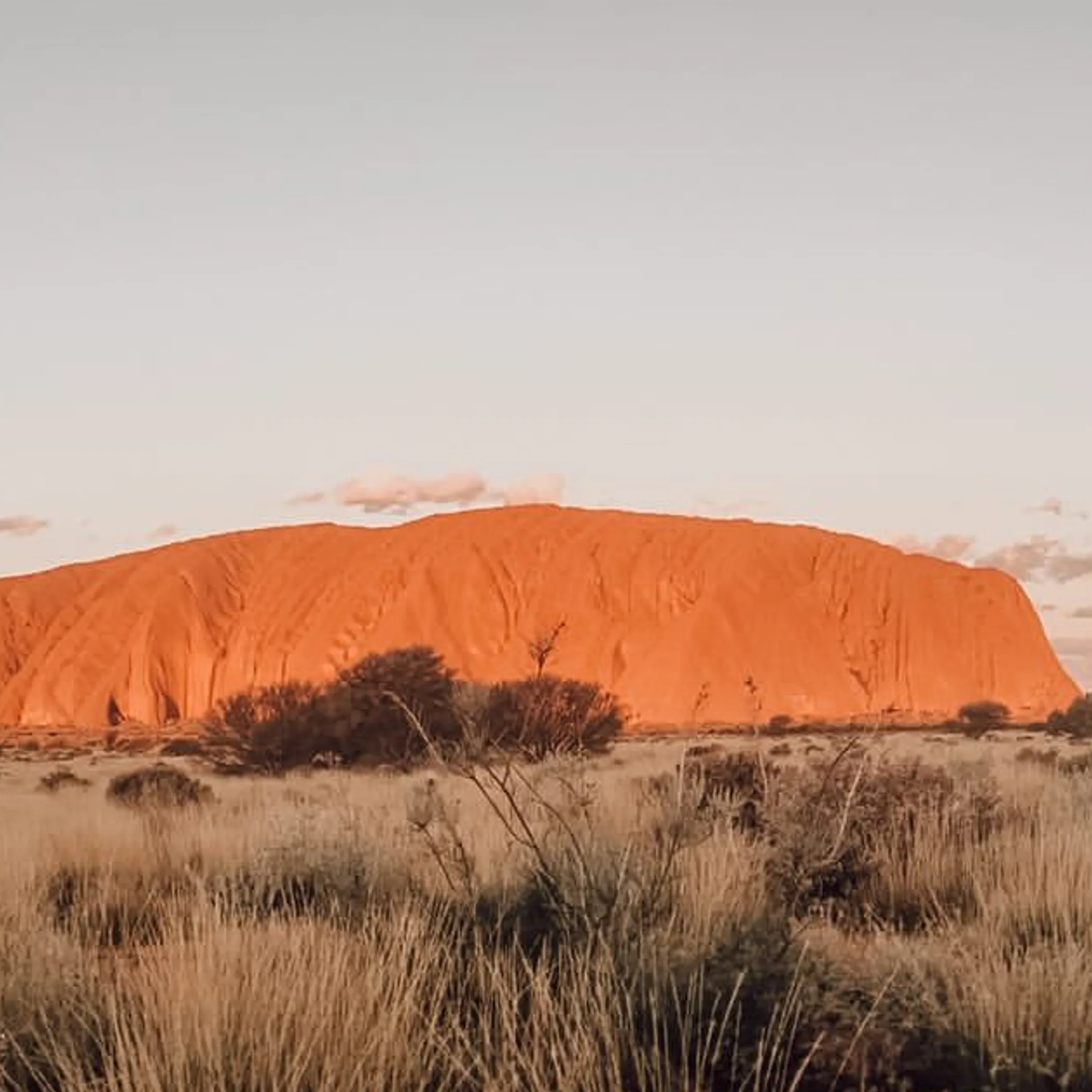 uluru rock under clear blue sky
