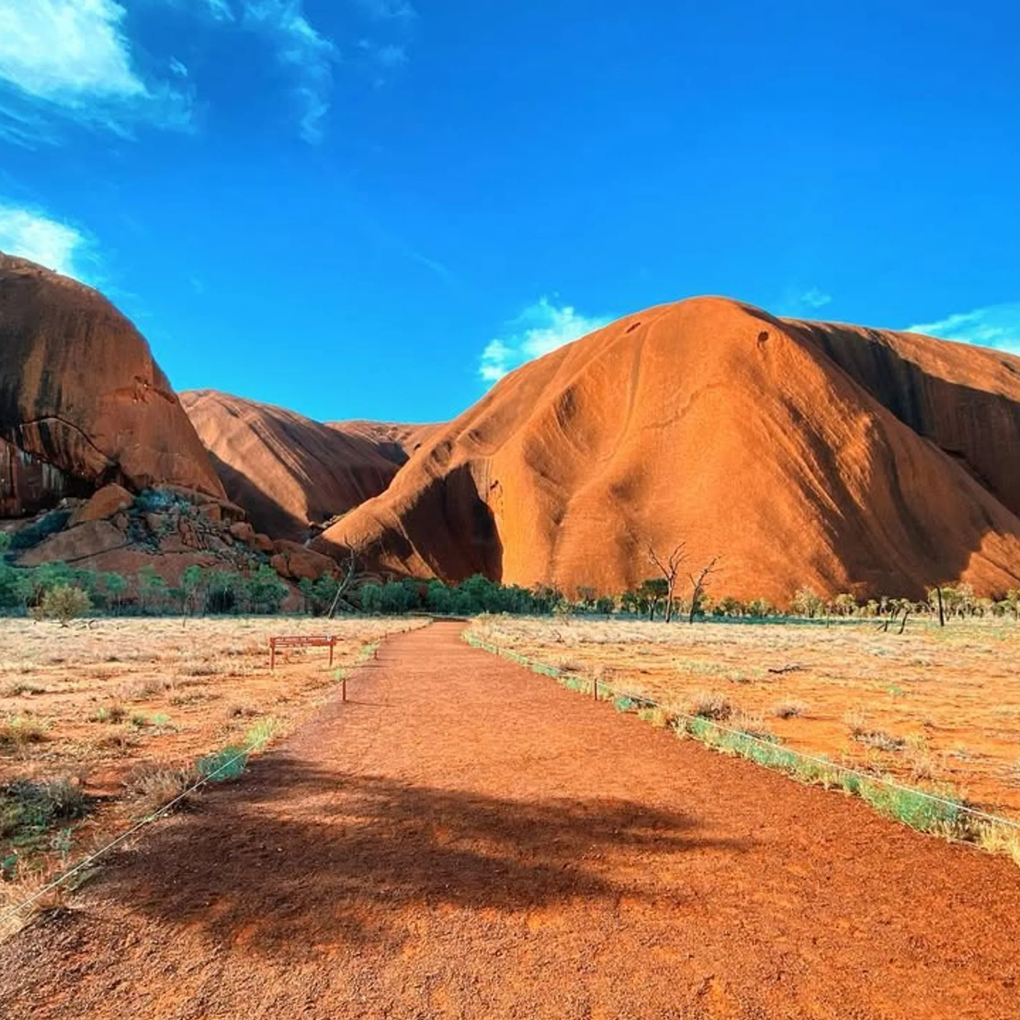 uluru with walking path nearby